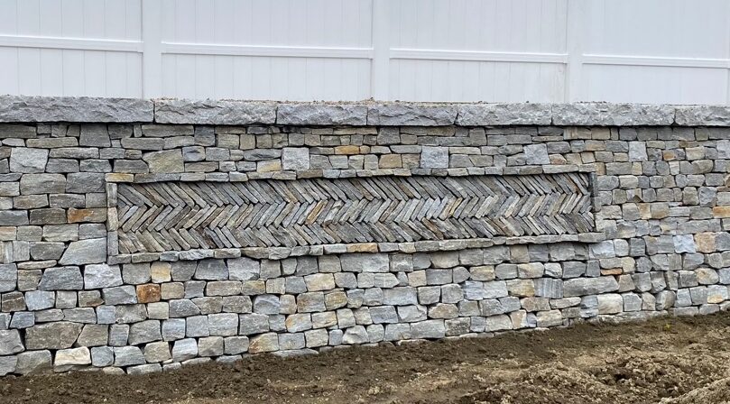 dry stone retaining wall with herring bone pattern